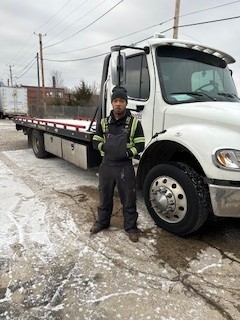 Maurice next to a truck